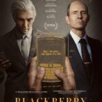 A sketched idea of a blackberry phone is framed by Jay Baruchel's character with a lightbulb above his head and Glenn Howerton's character with devil horns