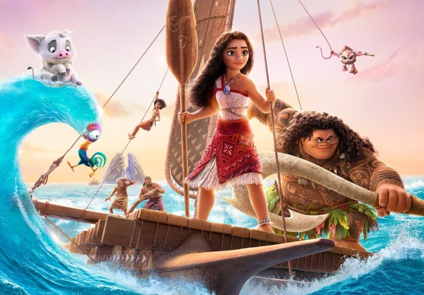 Moana stands confidently on her canoe with Maui hanging from the sail, striking a defiant pose and the other members of Moana's crew in the background.