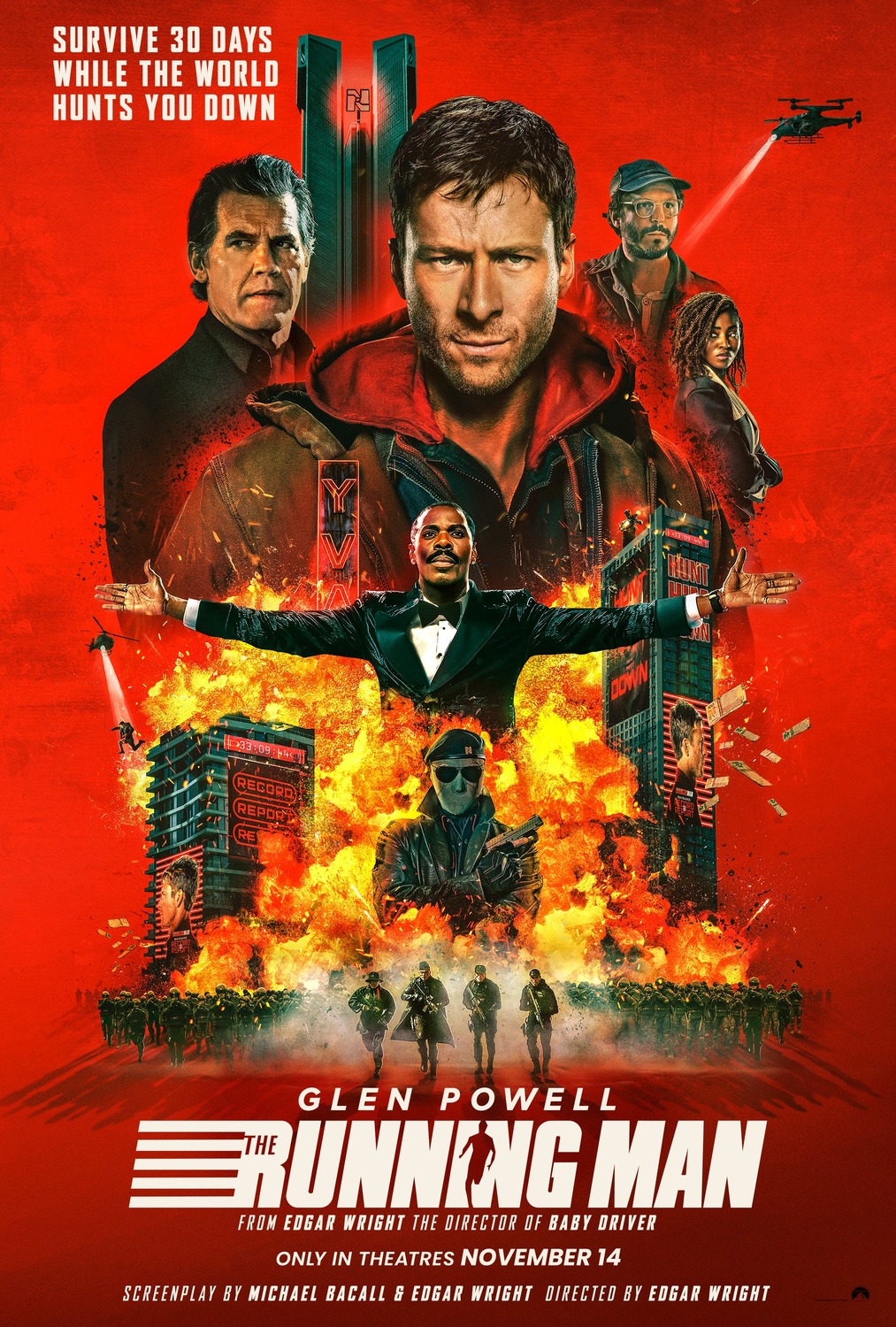 Glen Powell's grizzled expression stares out at the audience from a red backdrop, surrounded by other elaborate cast members and explosions